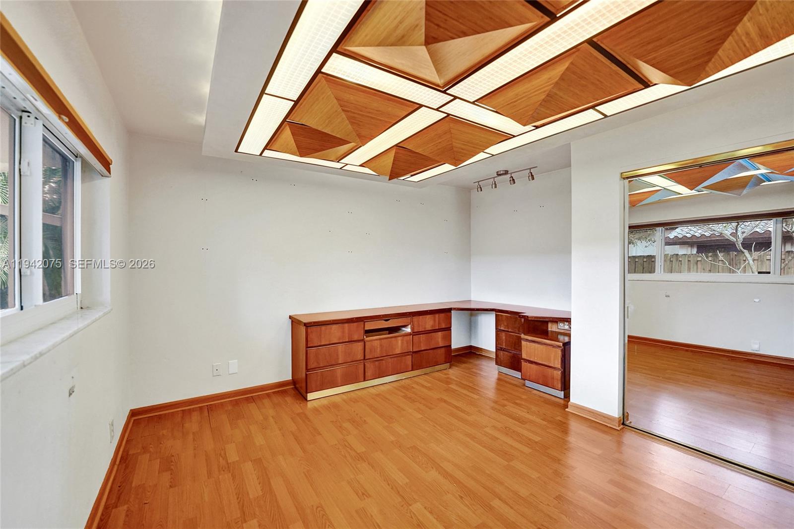 7420 Southwest 13th Street Plantation, FL 33317 - Photo 39 of 68 a room with wooden floor and white walls