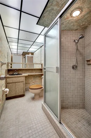 a bathroom with a shower and a sink