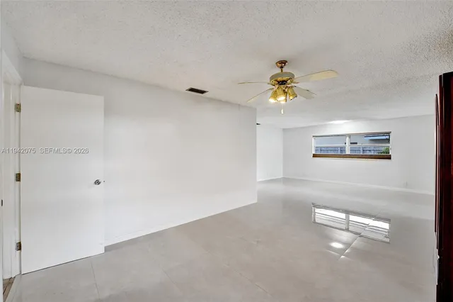 a view of a backyard with a patio