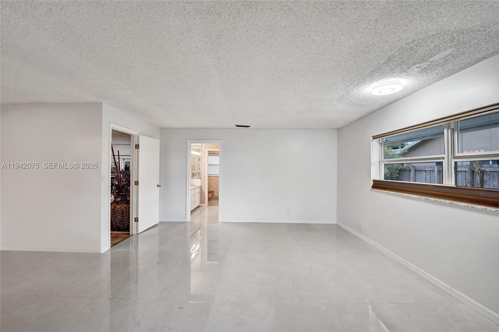 7420 Southwest 13th Street Plantation, FL 33317 - Photo 47 of 68 a view of an empty room with a window