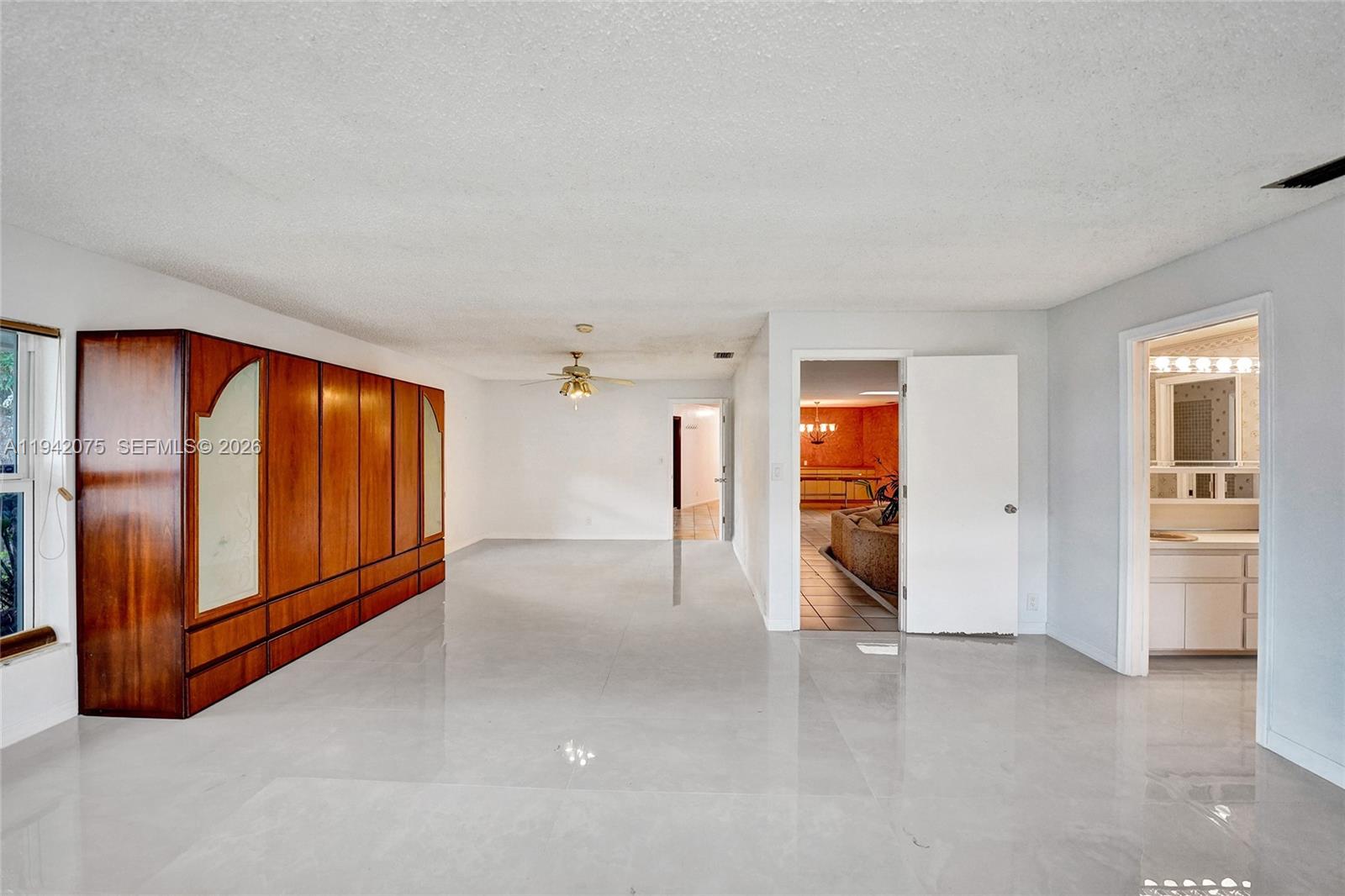 7420 Southwest 13th Street Plantation, FL 33317 - Photo 49 of 68 a view of an empty room with furniture and window
