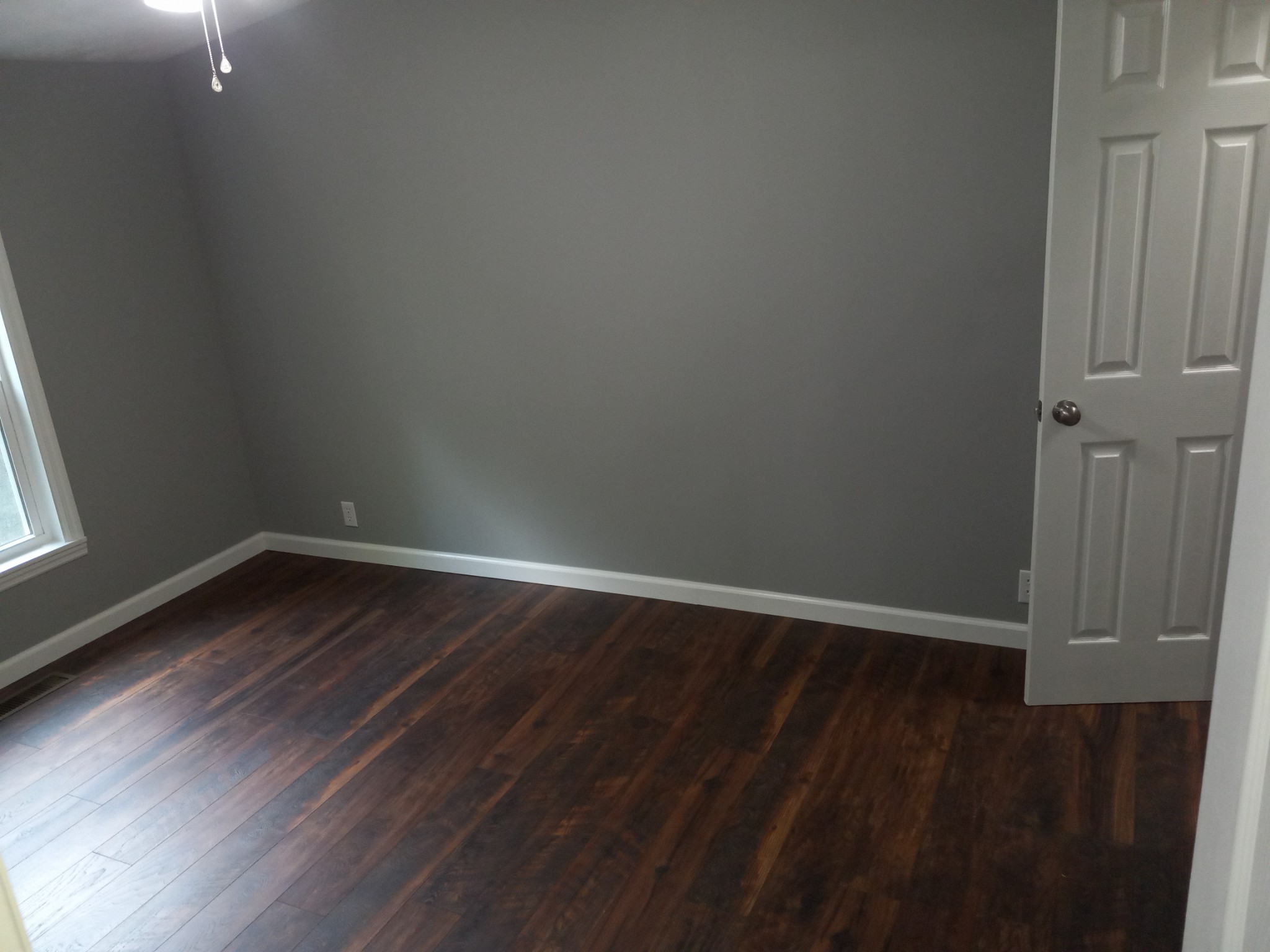 1800 Poplar Union Road Duck River, TN 38454 - Photo 11 of 17 a view of an empty room with wooden floor and a window