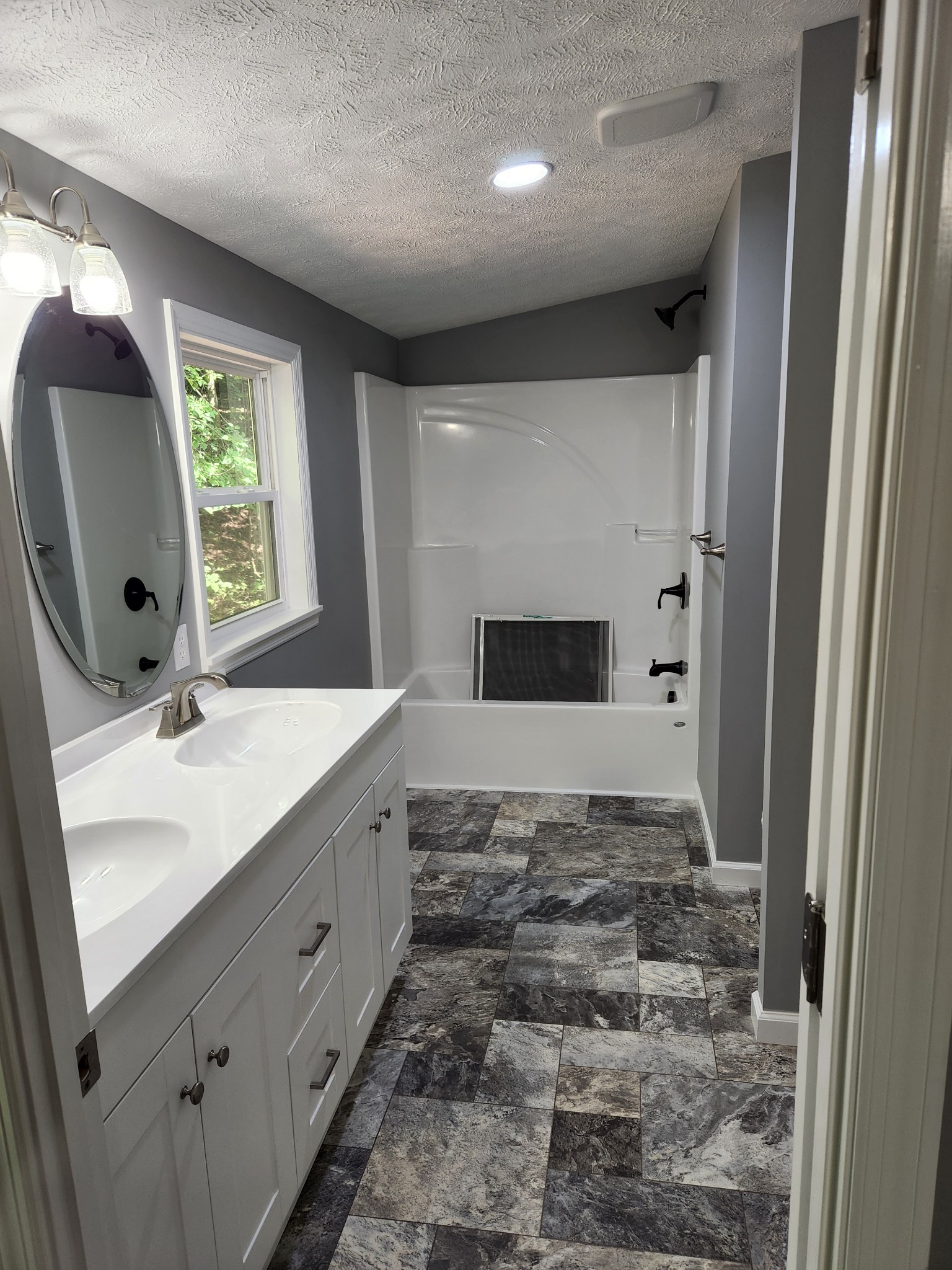 1800 Poplar Union Road Duck River, TN 38454 - Photo 13 of 17 a bathroom with a double vanity sink mirror and shower
