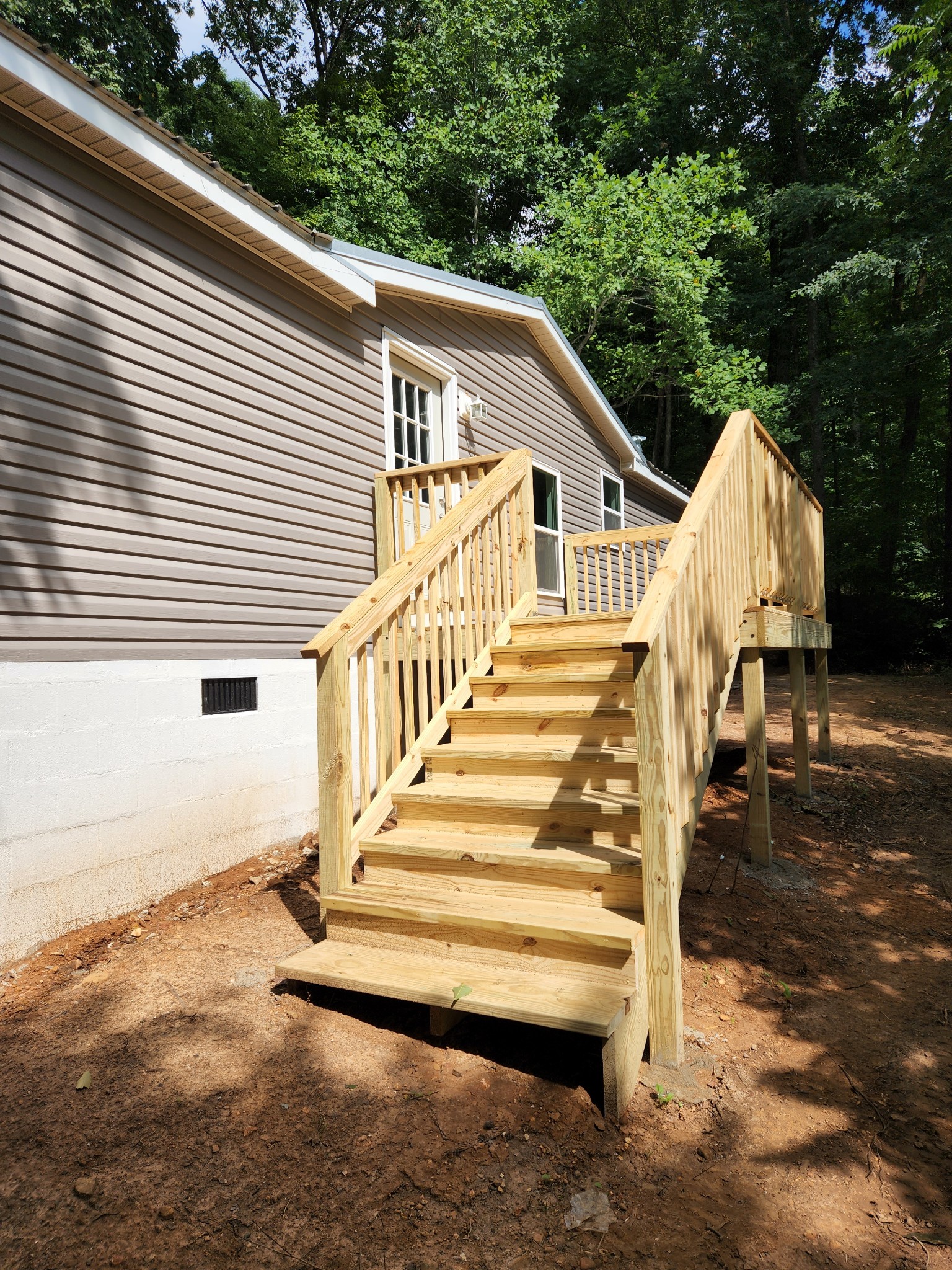 1800 Poplar Union Road Duck River, TN 38454 - Photo 2 of 17 a view of house with wooden stairs and a large tree