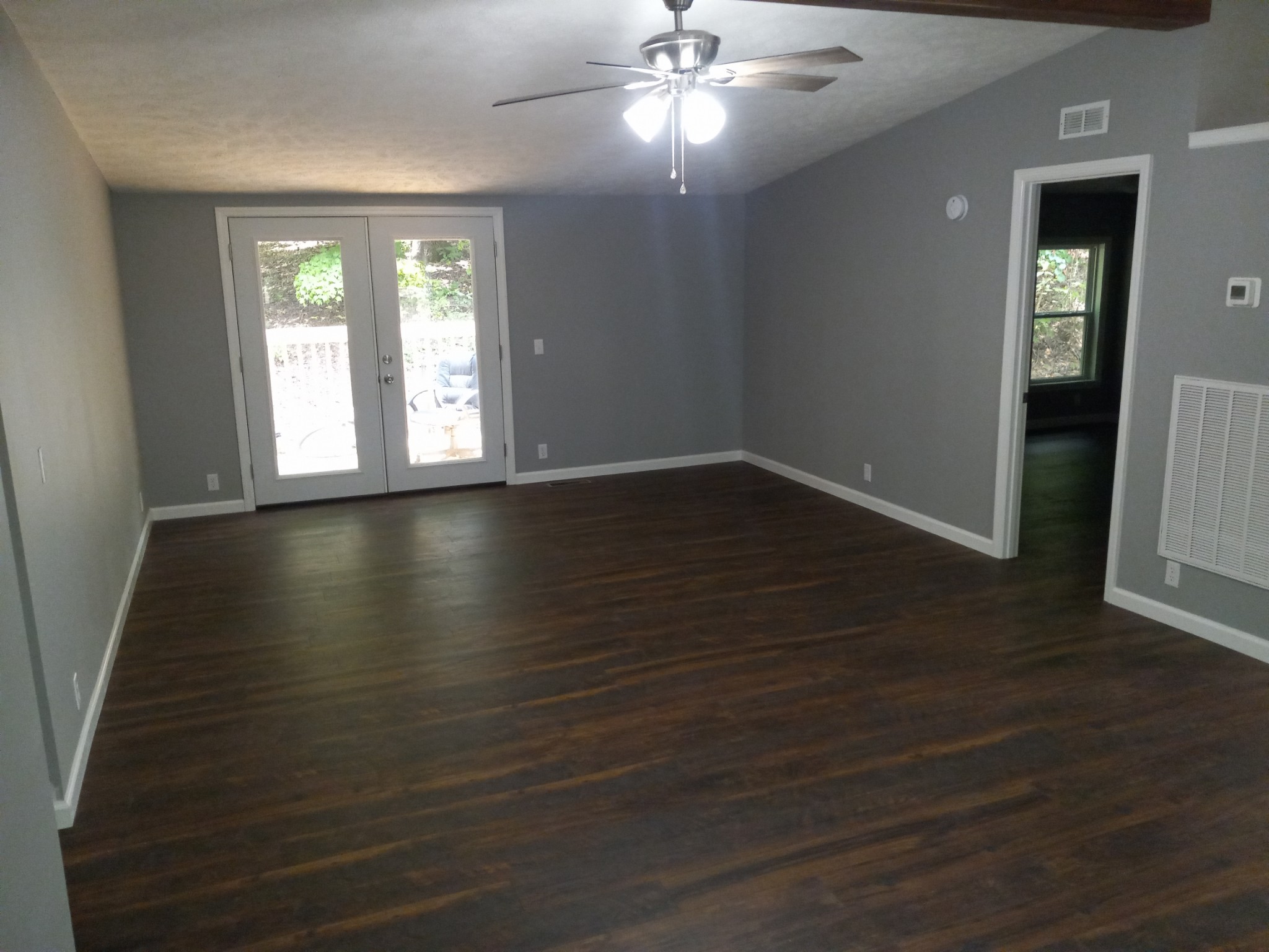 1800 Poplar Union Road Duck River, TN 38454 - Photo 4 of 17 a view of an empty room with wooden floor and a window