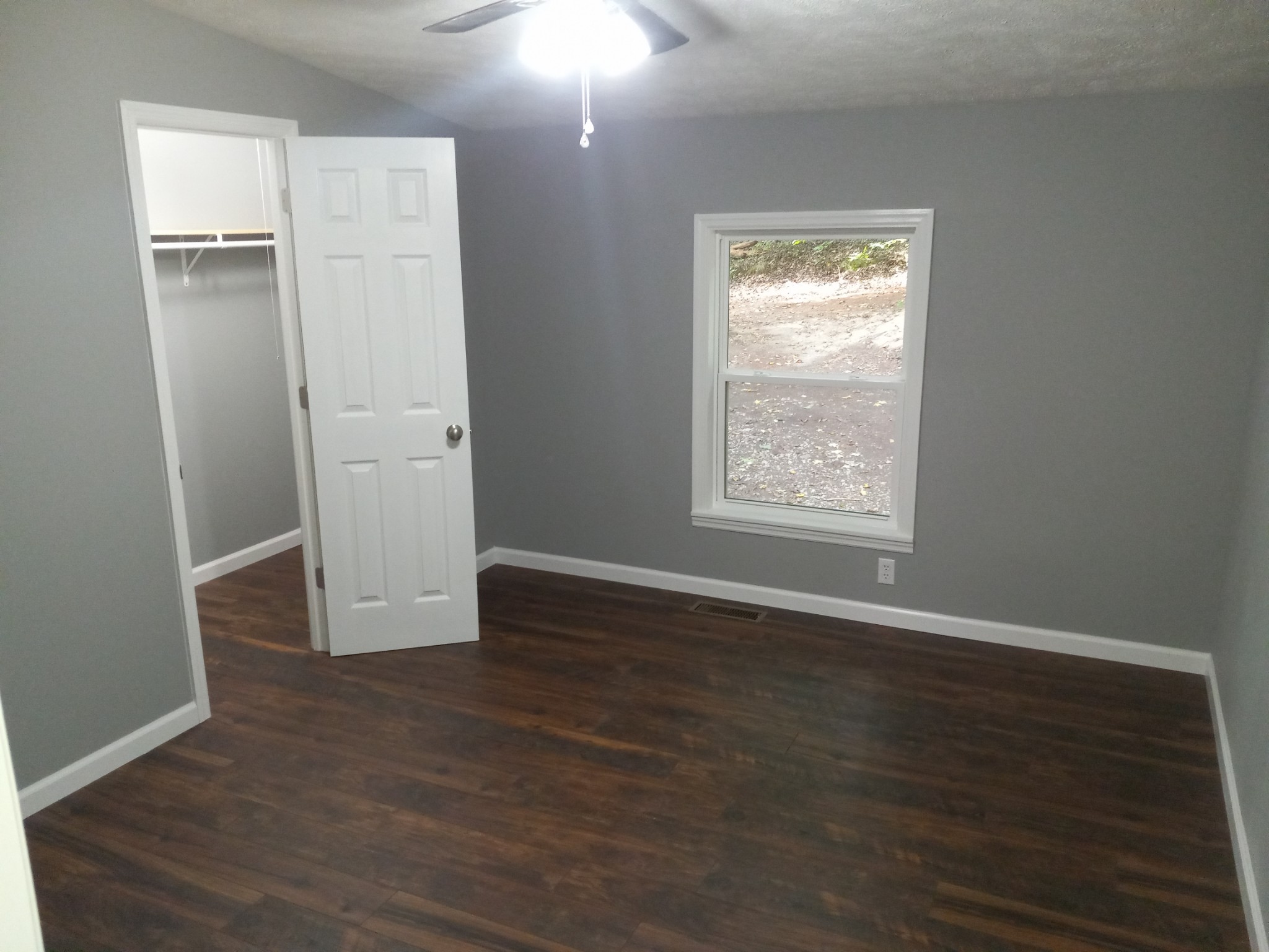 1800 Poplar Union Road Duck River, TN 38454 - Photo 10 of 17 an empty room with wooden floor closet and windows