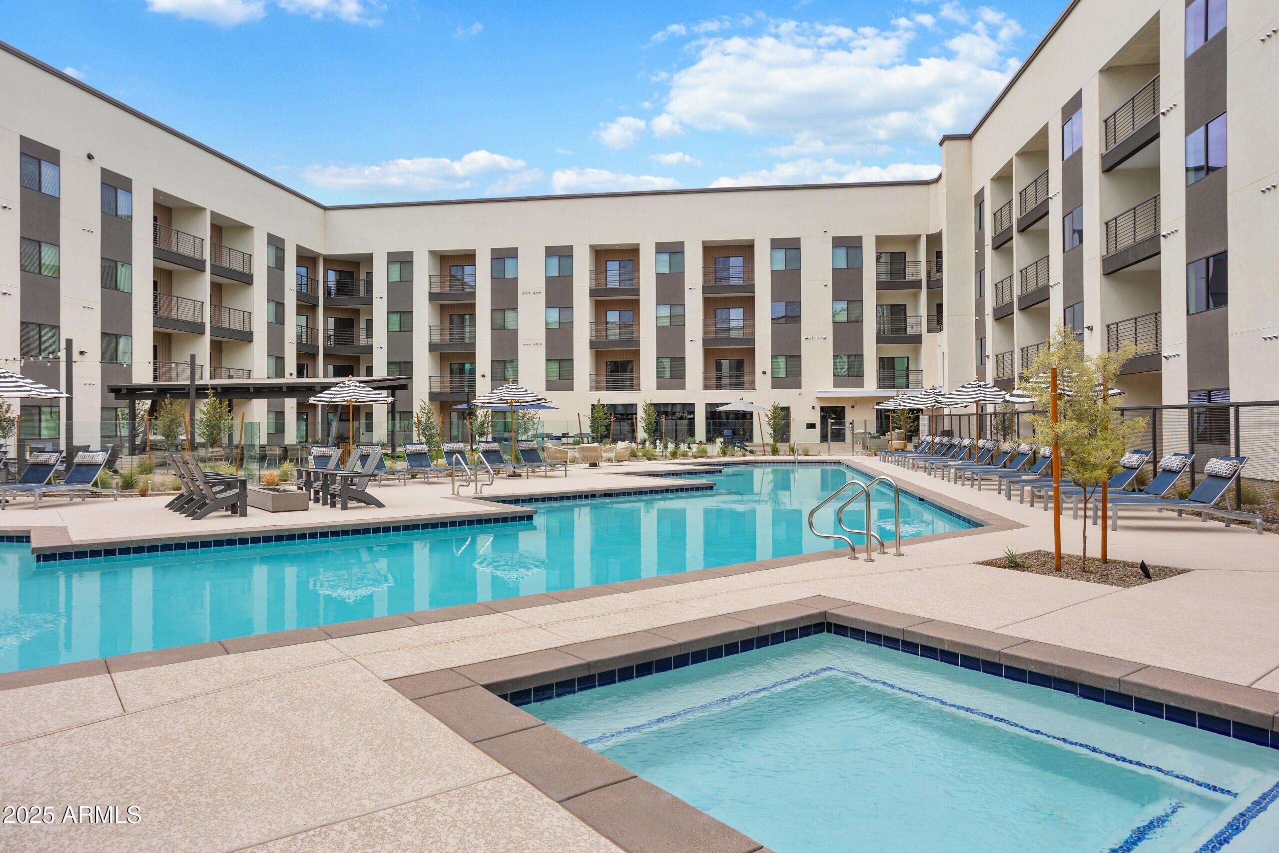 1225 North Arizona Avenue, Unit A1 1 Gilbert, AZ 85233 - Photo 12 of 20 a view of swimming pool with outdoor seating