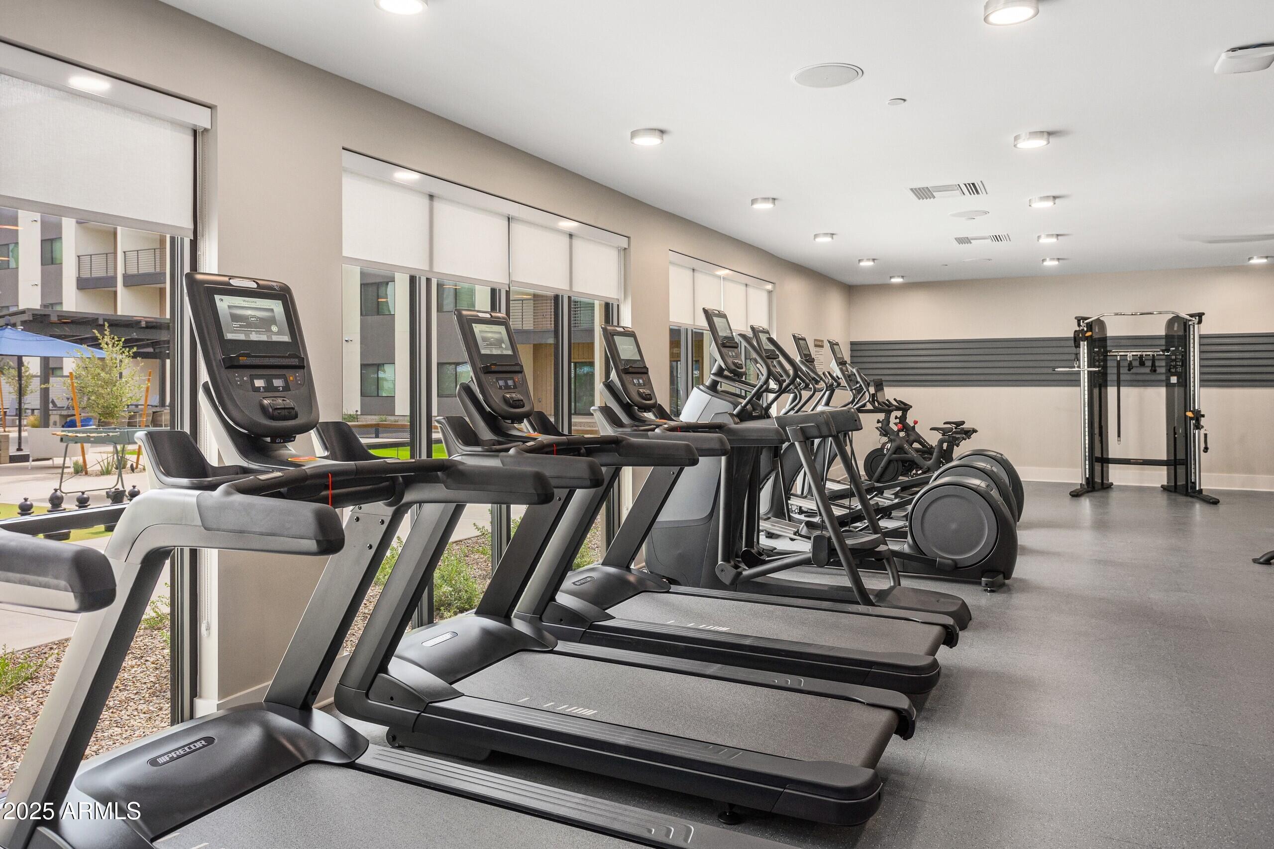 1225 North Arizona Avenue, Unit A1 1 Gilbert, AZ 85233 - Photo 13 of 20 a view of a room with gym equipment