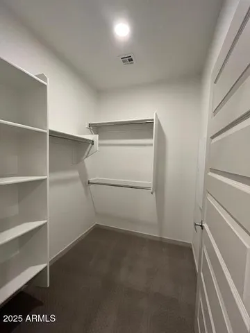 a view of an empty walk in closet