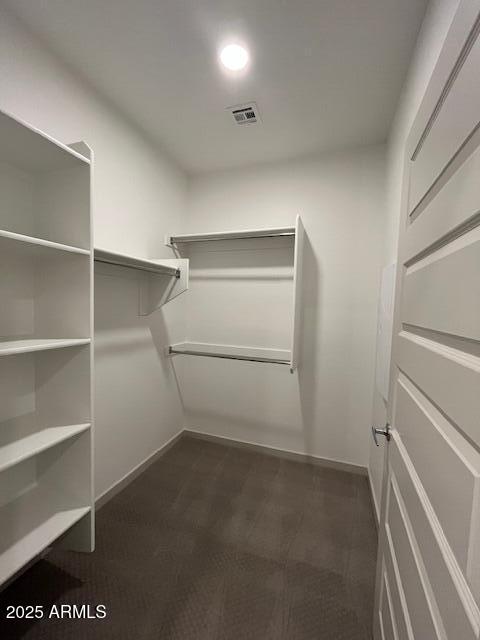 1225 North Arizona Avenue, Unit A1 1 Gilbert, AZ 85233 - Photo 7 of 20 a view of an empty walk in closet