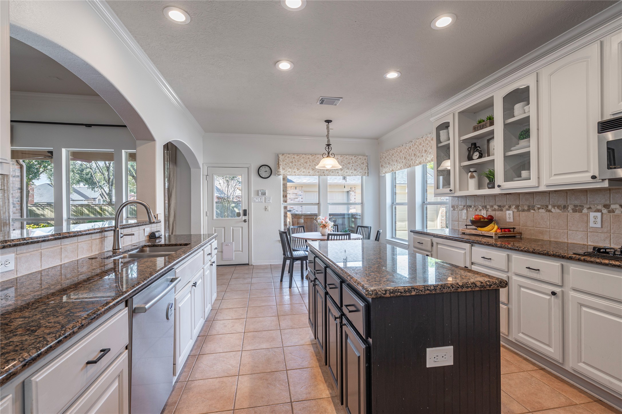 700 Red Oak Lane Friendswood, TX 77546 - Photo 20 of 48 a large kitchen with granite countertop lots of counter space and sink
