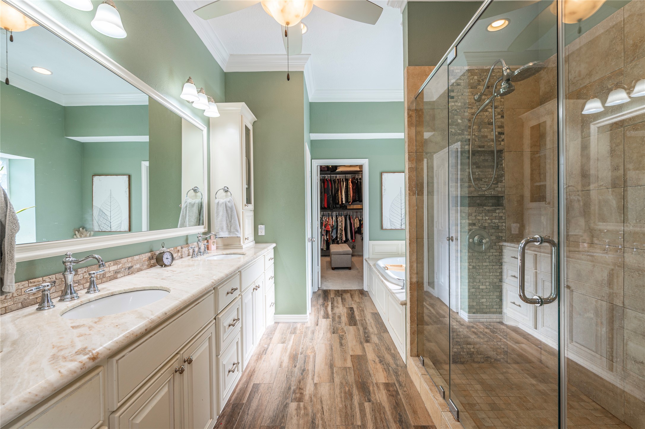 700 Red Oak Lane Friendswood, TX 77546 - Photo 24 of 48 a spacious bathroom with a granite countertop sink mirror and shower