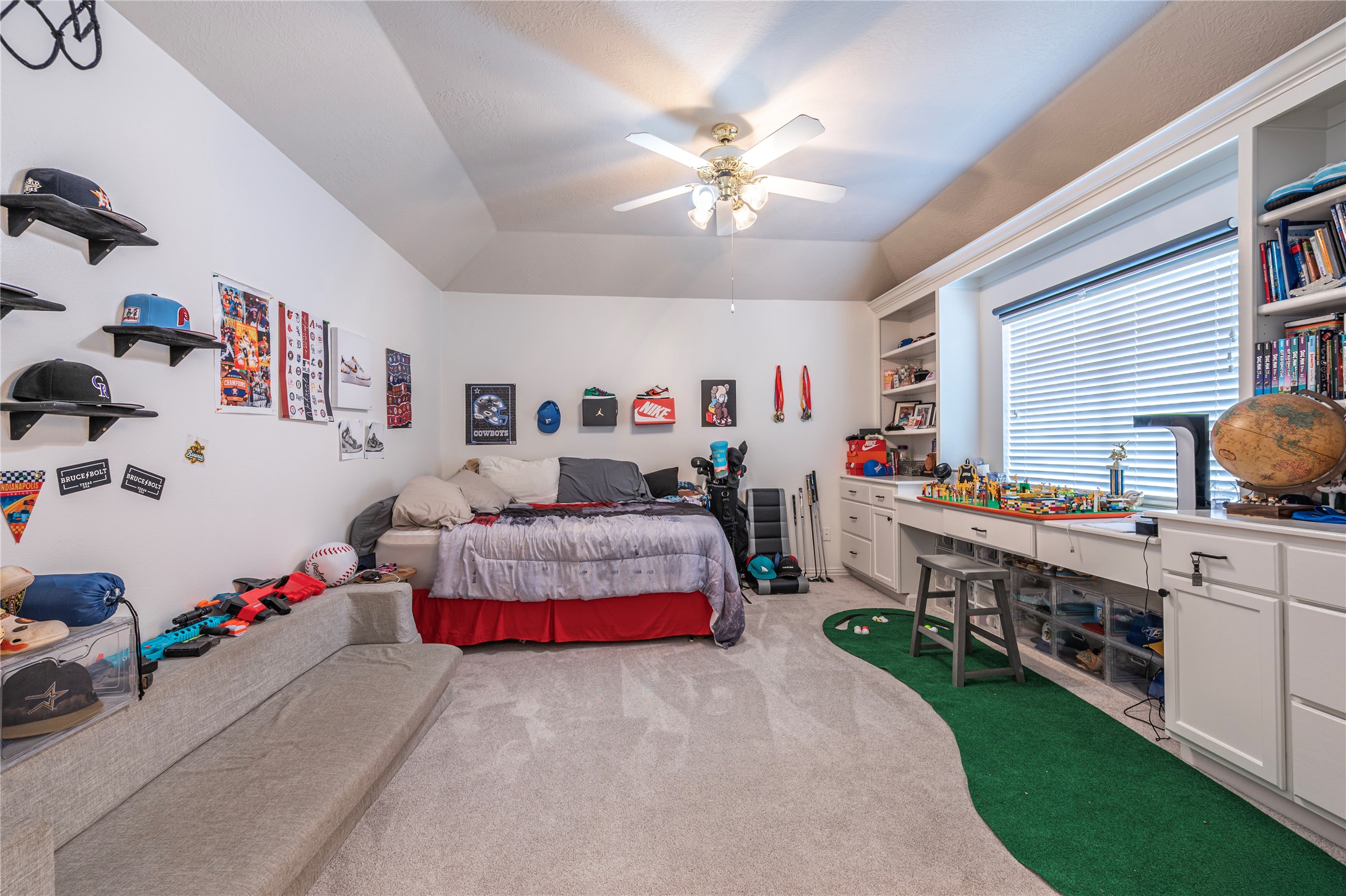 700 Red Oak Lane Friendswood, TX 77546 - Photo 29 of 48 a bedroom with bed and a chandelier