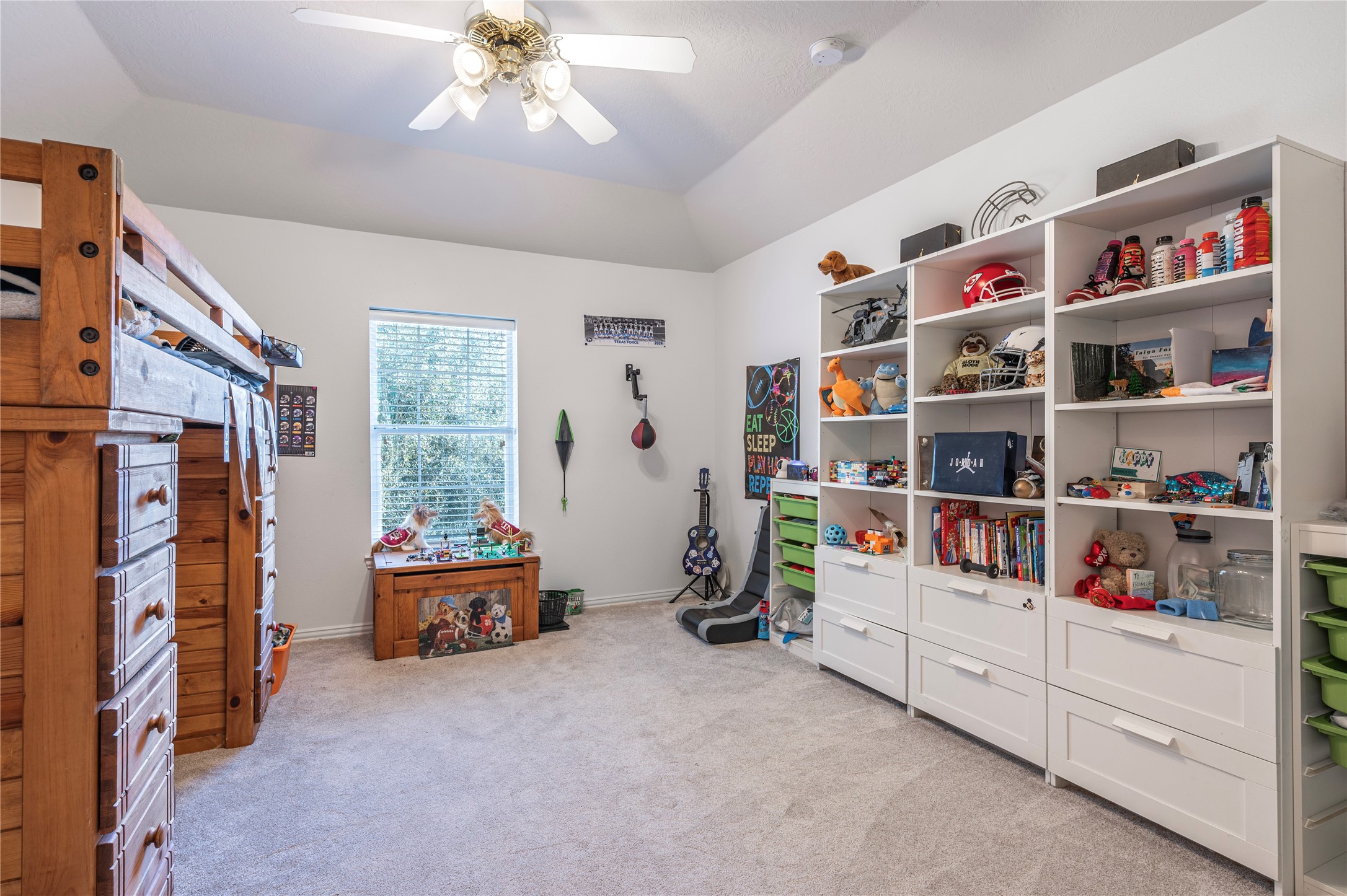 700 Red Oak Lane Friendswood, TX 77546 - Photo 32 of 48 a room with toys and white cabinets