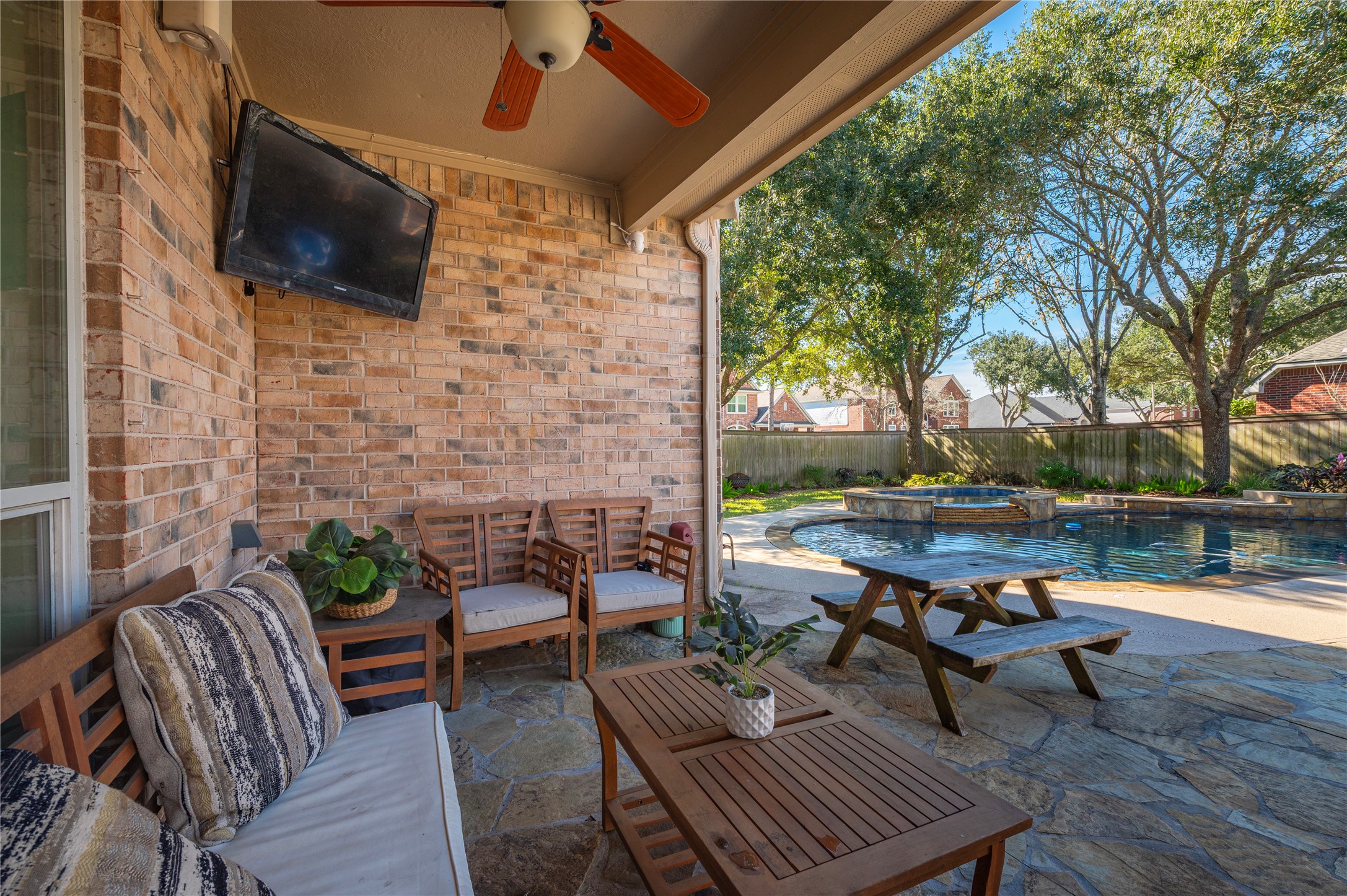 700 Red Oak Lane Friendswood, TX 77546 - Photo 38 of 48 a backyard of a house with outdoor seating