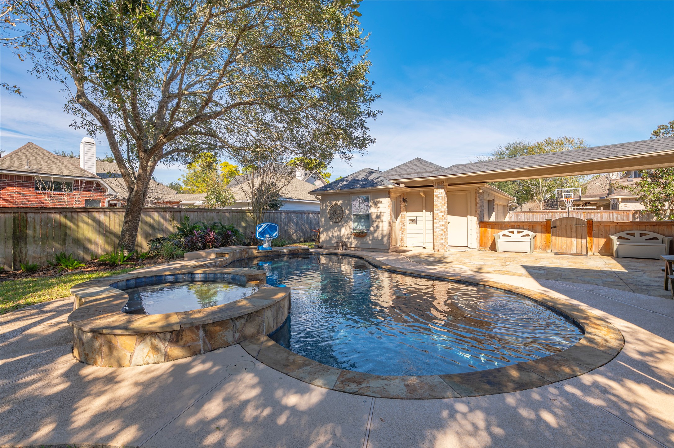700 Red Oak Lane Friendswood, TX 77546 - Photo 41 of 48 a view of a swimming pool with a patio