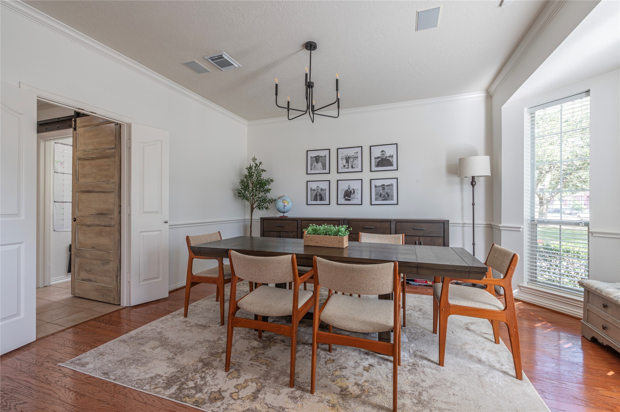 700 Red Oak Lane Friendswood, TX 77546 - Photo 7 of 48 a view of a dining room with furniture window and wooden floor