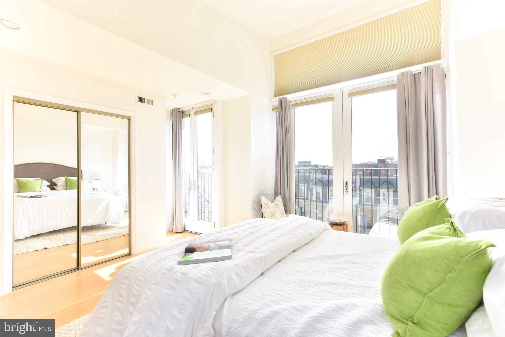 2713 Ontario Road Northwest, Unit 4 Washington, DC 20009 - Photo 15 of 25 a bedroom with a bed and a large window