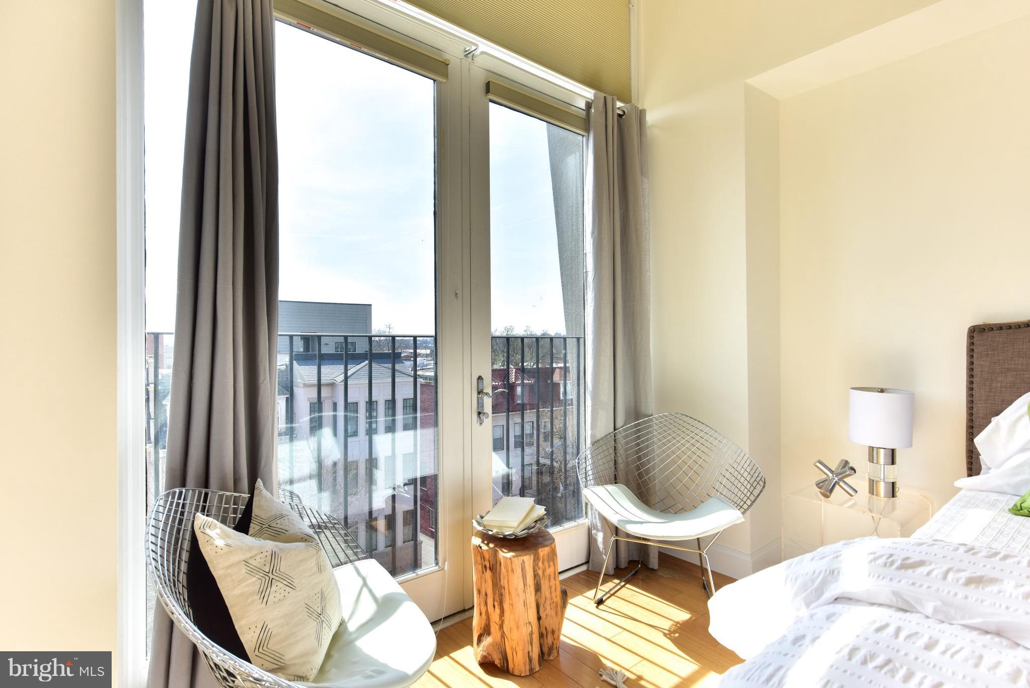 2713 Ontario Road Northwest, Unit 4 Washington, DC 20009 - Photo 16 of 25 a living room with furniture and a floor to ceiling window