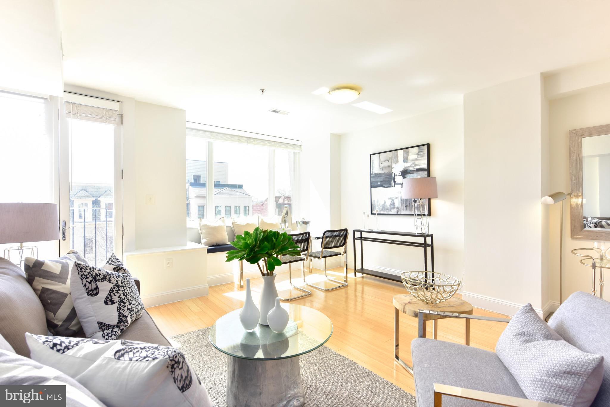 2713 Ontario Road Northwest, Unit 4 Washington, DC 20009 - Photo 2 of 25 a living room with furniture and a table