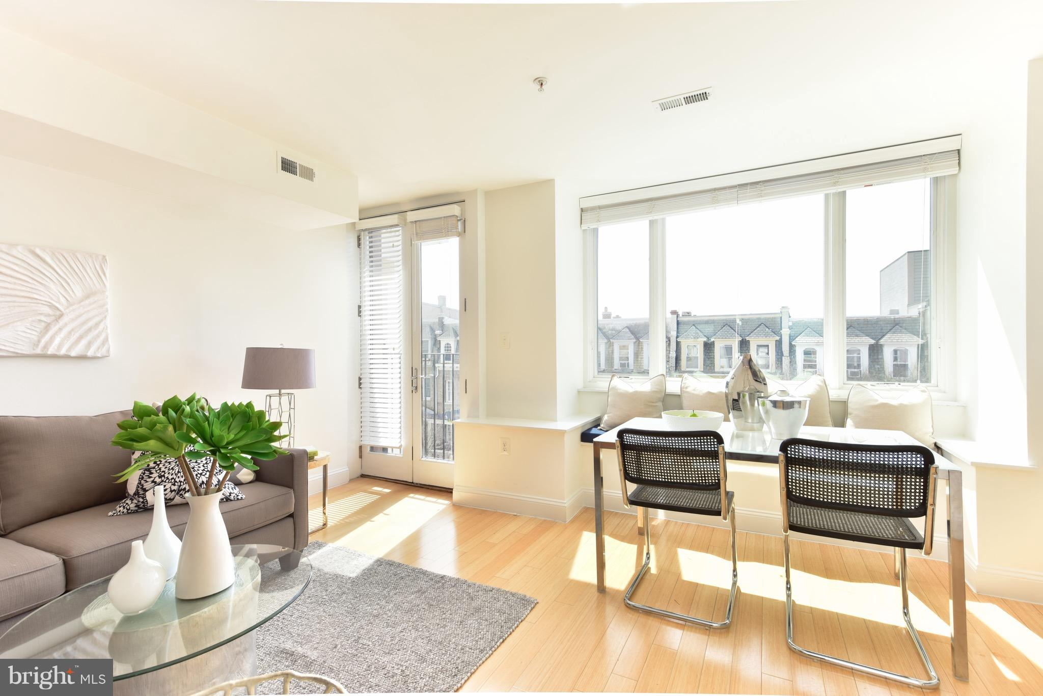 2713 Ontario Road Northwest, Unit 4 Washington, DC 20009 - Photo 3 of 25 a living room with furniture and a potted plant