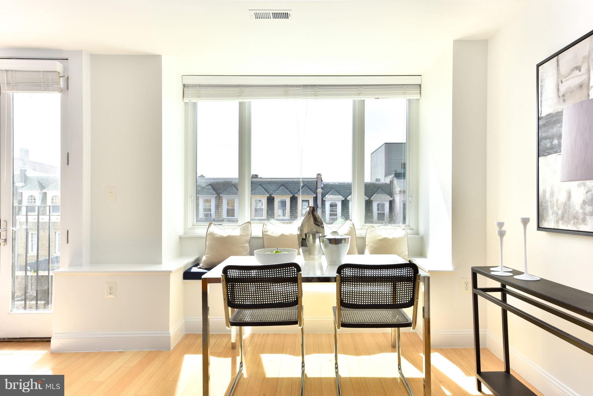 2713 Ontario Road Northwest, Unit 4 Washington, DC 20009 - Photo 4 of 25 a living room with furniture and a floor to ceiling window