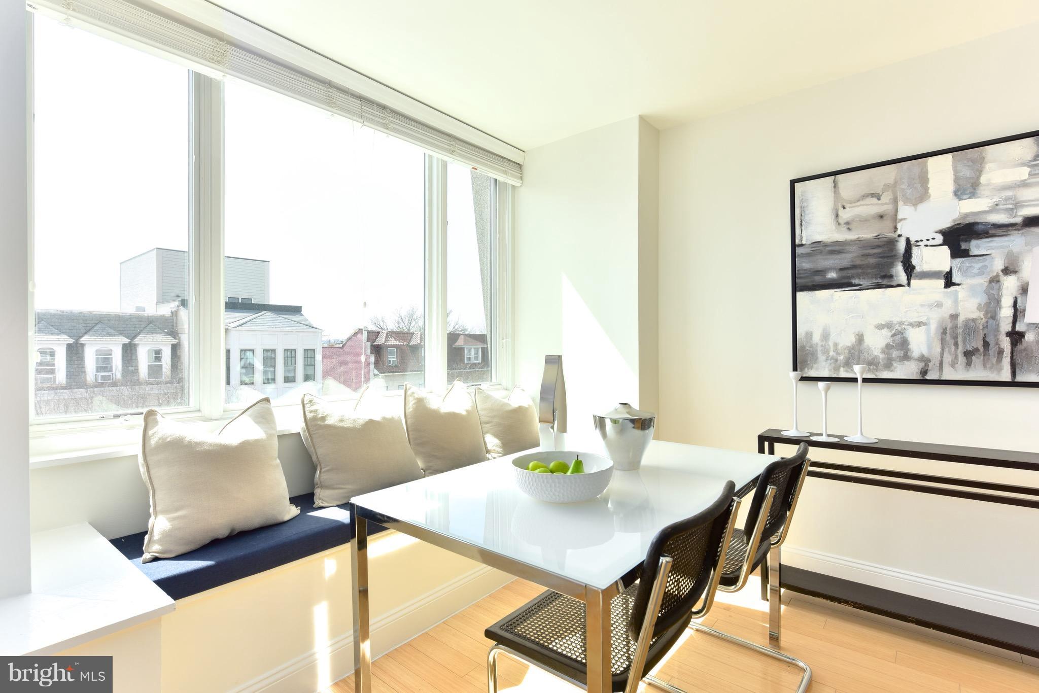 2713 Ontario Road Northwest, Unit 4 Washington, DC 20009 - Photo 5 of 25 a view of a dining room with furniture and a window