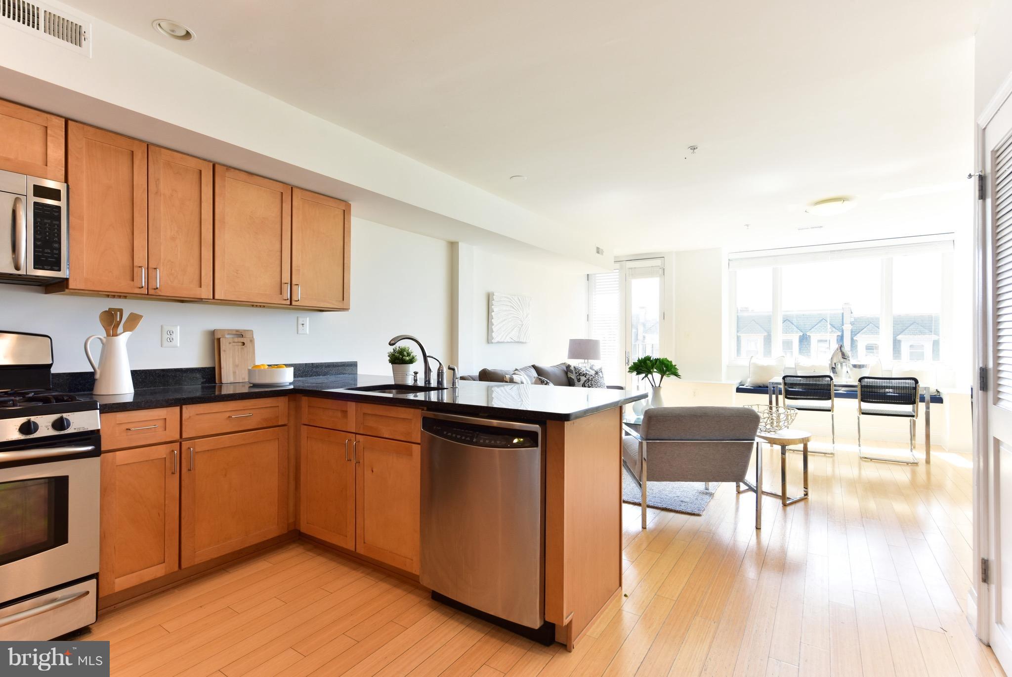 2713 Ontario Road Northwest, Unit 4 Washington, DC 20009 - Photo 8 of 25 a kitchen with granite countertop lots of counter top space and dining table