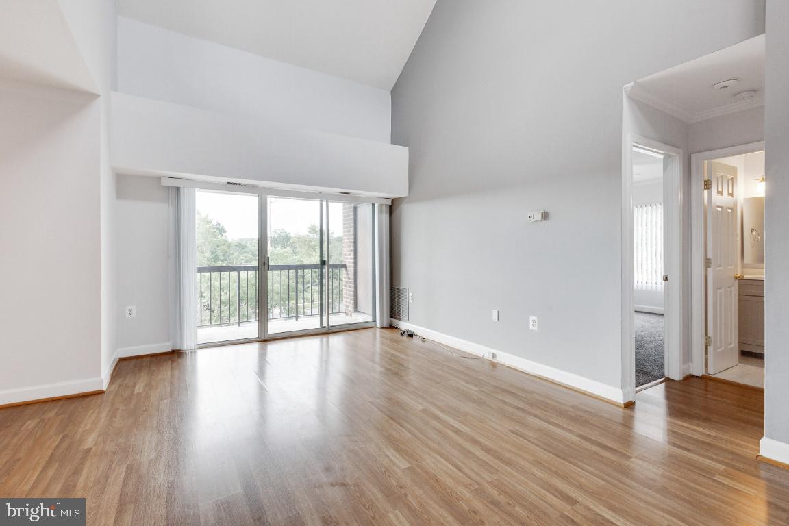 15601 Dorset Road, Unit 11 Laurel, MD 20707 - Photo 9 of 31 Living room w/ Vaulted Ceilings