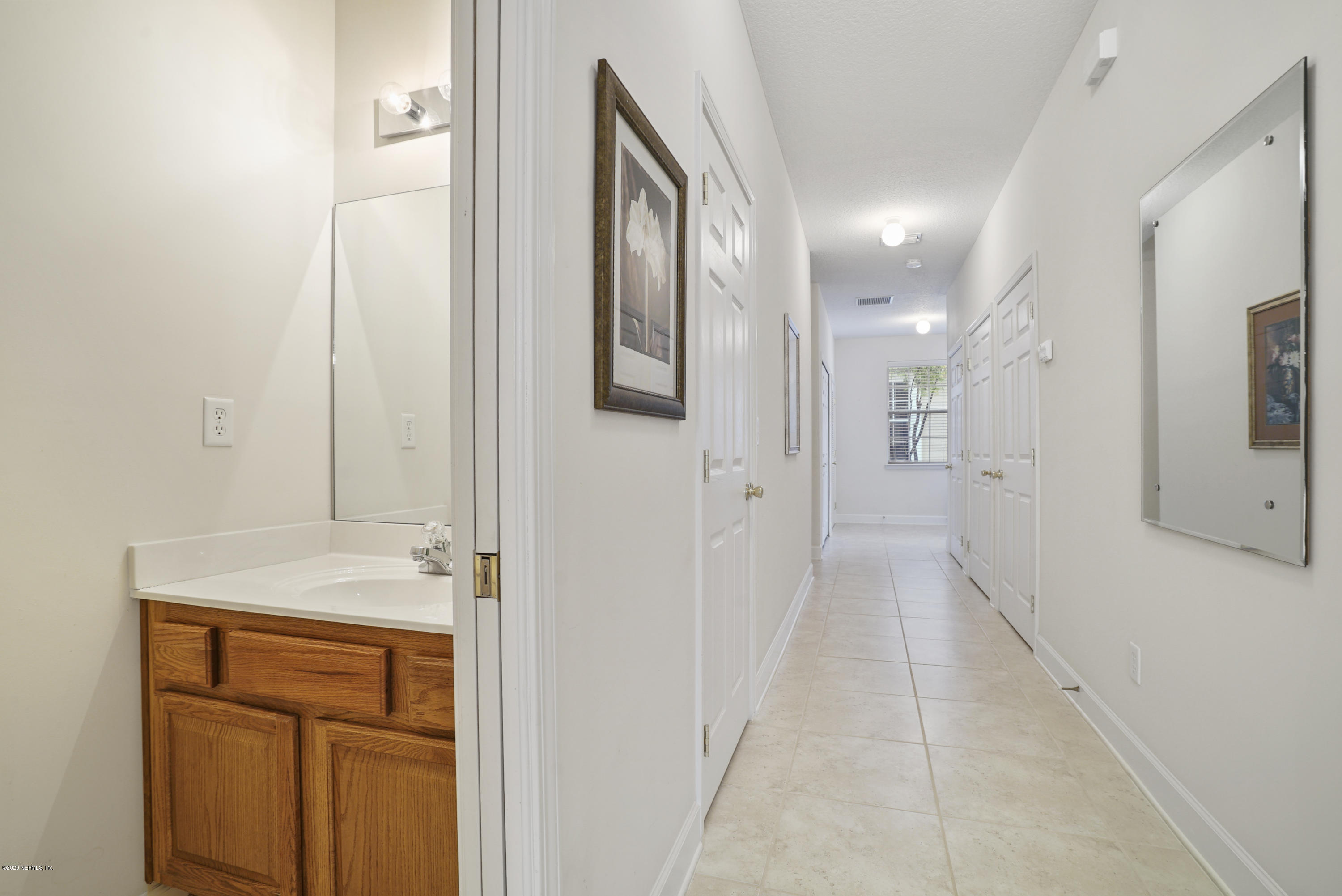 3158 Ravines Road Middleburg, FL 32068 - Photo 13 of 34 a view of a hallway with wooden floor
