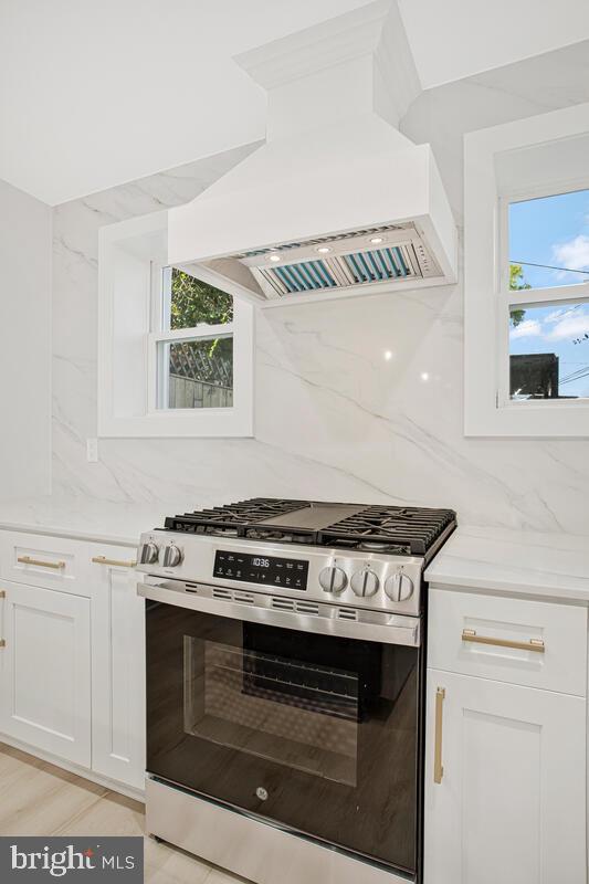 2258 Brookfield Avenue Baltimore, MD 21217 - Photo 15 of 42 a stove top oven sitting inside of a kitchen