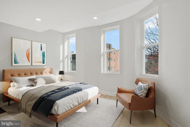 a bedroom with bed and a window