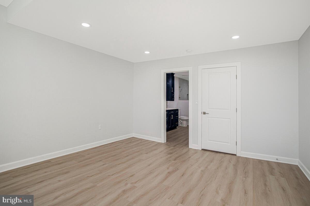 2258 Brookfield Avenue Baltimore, MD 21217 - Photo 28 of 42 a view of an empty room with wooden floor and closet