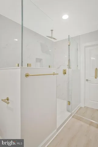 a bathroom with a shower and a sink