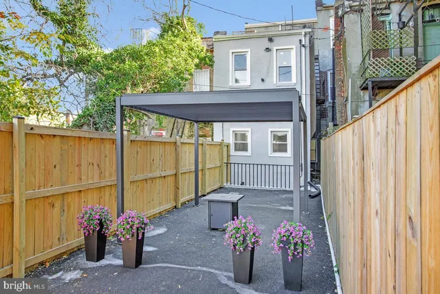 a view of a house with a potted plant