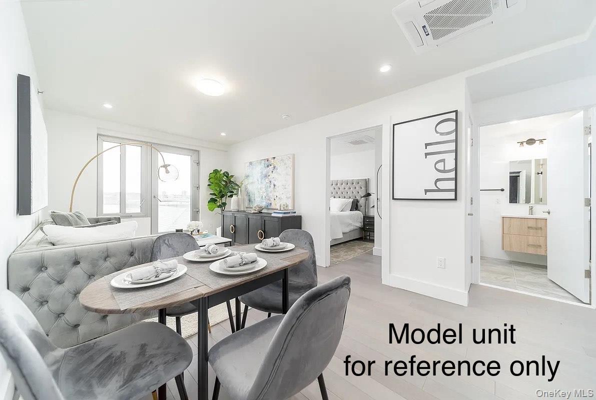 131-19 Fowler Avenue, Unit 4A Queens, NY 11355 - Photo 4 of 8 a view of a dining room with furniture and wooden floor