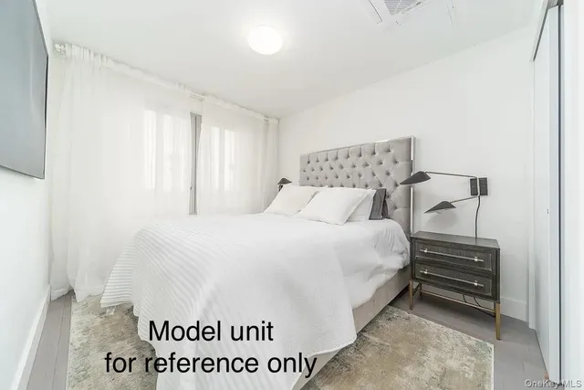 a bedroom with a bed and a table