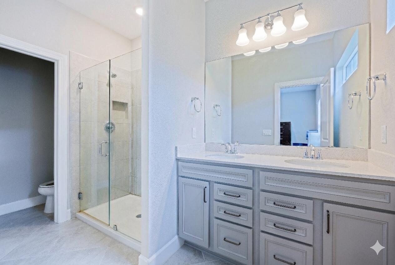 1832 Southeast Roxy Way Stuart, FL 34996 - Photo 11 of 17 a spacious bathroom with double sink and shower