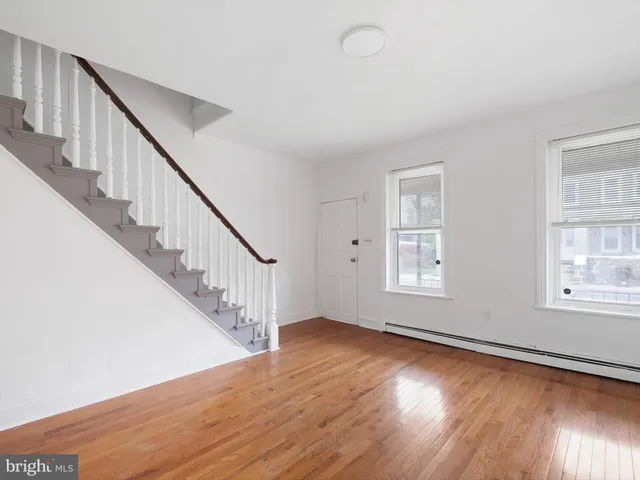 a view of room with window and hardwood floor