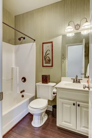 a bathroom with a sink a toilet and a bathtub