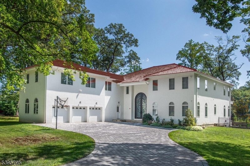 34 West Shore Road Mountain Lakes, NJ 07046 - Photo 2 of 46 a view of a white house with a big yard plants and large trees