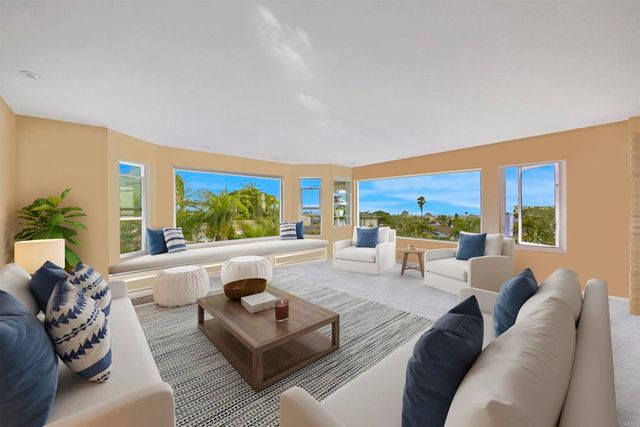 a dining room with furniture and entryway