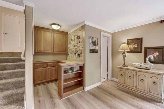 a spacious bathroom with a double vanity sink a large mirror and shower