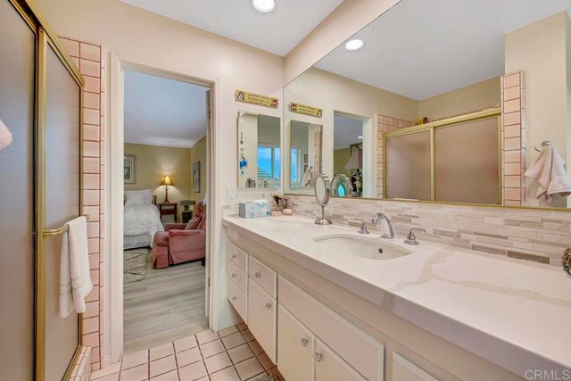 a spacious bedroom with a bed and a large window