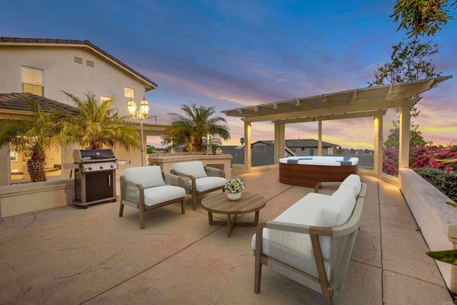a view of a kitchen with furniture and a potted plant