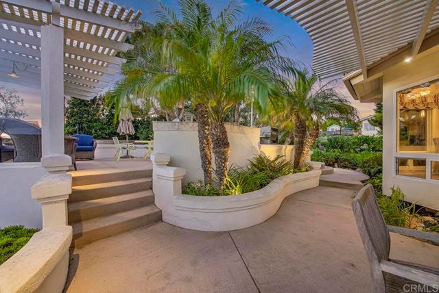a dining room with furniture and a floor to ceiling window