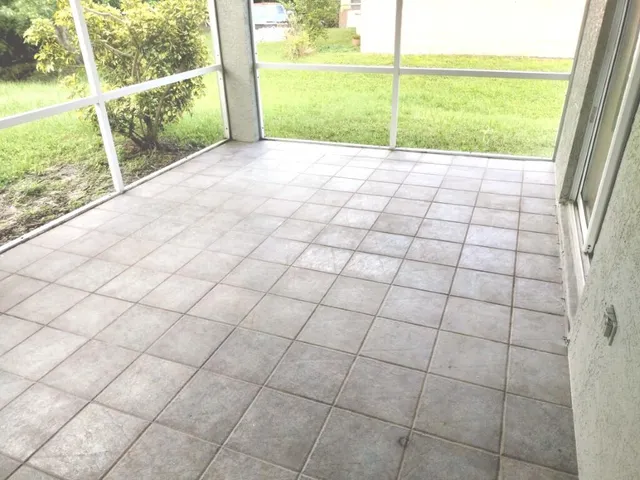 en empty room with window and outdoor view