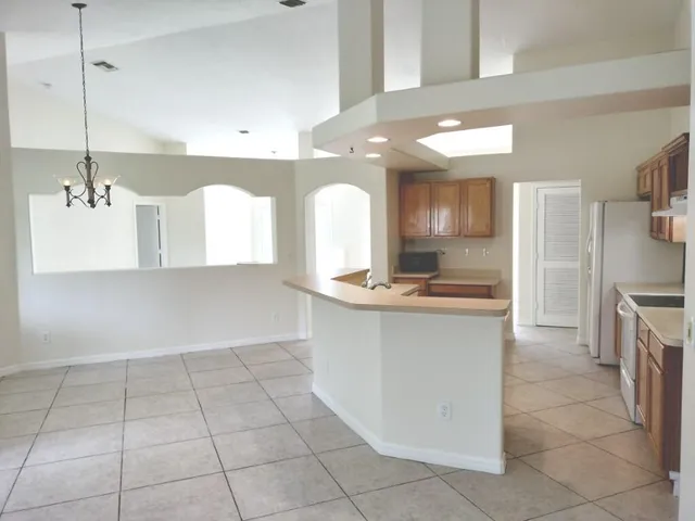 a kitchen that has a sink and a stove in it
