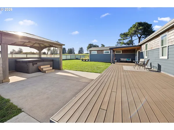 a view of a backyard with sitting area