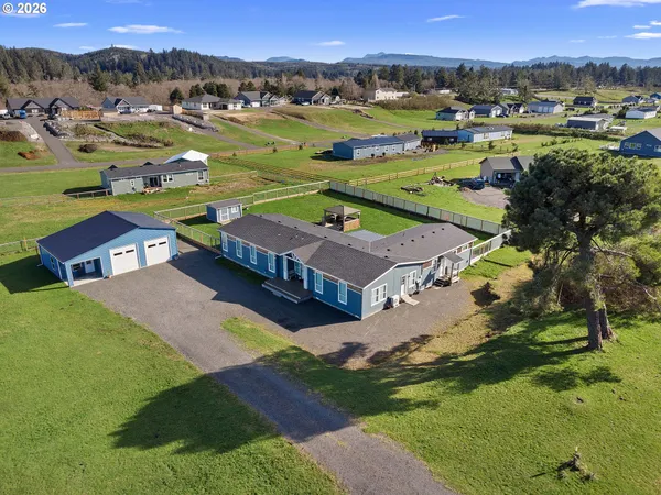 an aerial view of a house with a garden